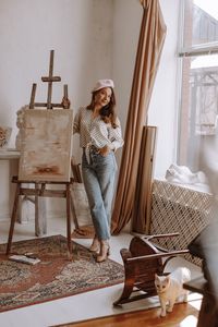 Portrait of smiling young woman sitting in tent