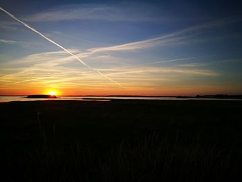 Scenic view of silhouette landscape against sky during sunset