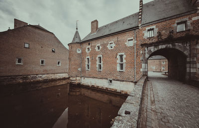 View of old building against cloudy sky