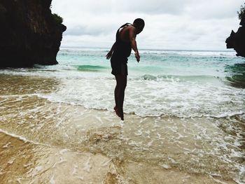 Man jumping on beach