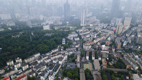 High angle view of crowd and buildings in city