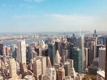 Aerial view of modern buildings in city against sky