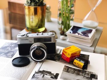 Close-up of camera on table at home