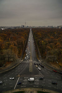 Cars on street against sky