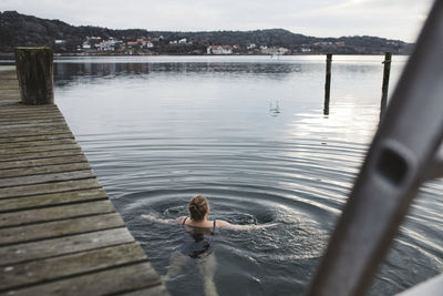 Woman swimming in lake