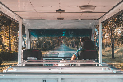 Rear view of people sitting in bus