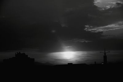 Silhouette of building at sunset