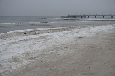 Scenic view of beach against clear sky