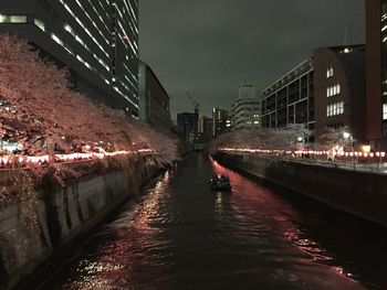 Illuminated buildings in city at night