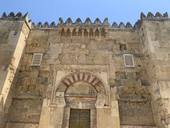 Low angle view of old building against sky