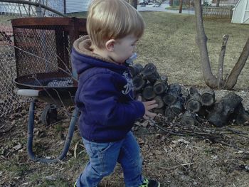 Cute boy standing outdoors