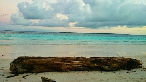 Scenic view of sea against cloudy sky