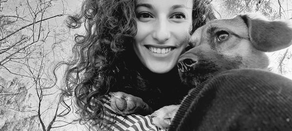 Portrait of smiling woman with dog