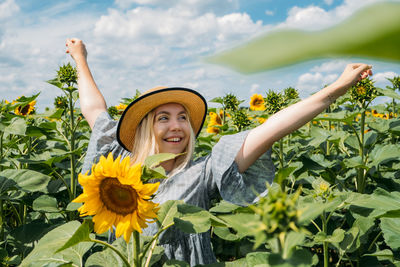 Ukrainian girl young woman on the background of sunflowers field. ukraine sunflowers national