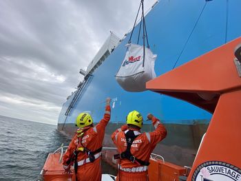 Low angle view of ship in sea against sky