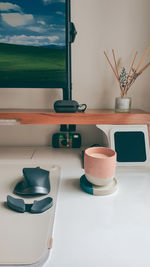 Aesthetic minimalist desk with a cup of coffee 