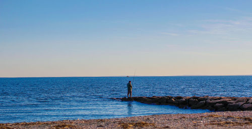 Scenic view of sea against clear sky