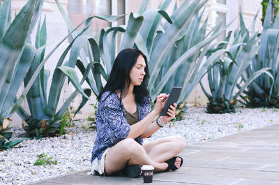 Happy asian woman, student relaxing, working in city, garden. laptop, phone. social media. summer