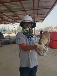 Portrait of young man standing outdoors