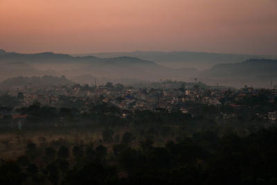 High angle view of townscape against sky during sunset