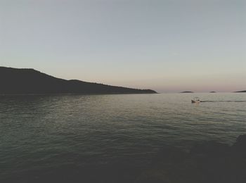 Scenic view of sea against clear sky during sunset