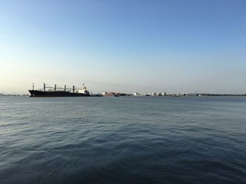 Scenic view of sea against clear blue sky