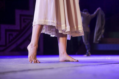 Low section of woman standing on floor