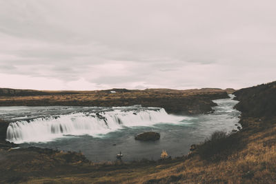 Scenic view of river against sky