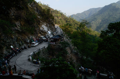 High angle view of people on road by trees