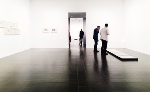 People walking on tiled floor