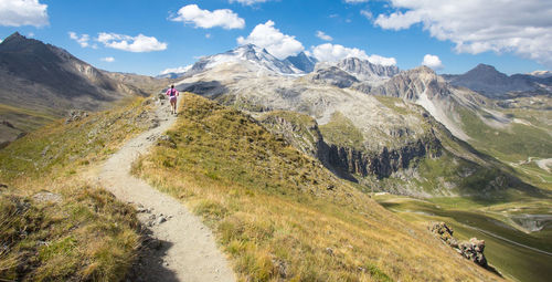 Hiking on the heights of tignes in savoie in haute tarentaise in the vanoise massif in the alps 