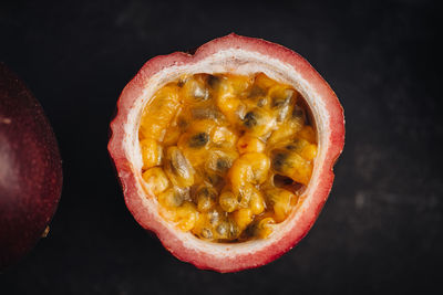 Directly above shot of fruit on table against black background