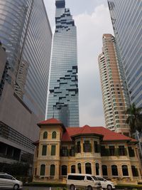 Modern buildings in city against sky