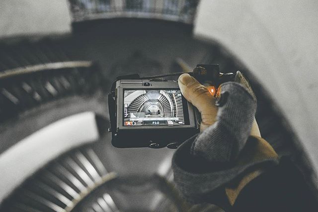 MAN PHOTOGRAPHING CAMERA