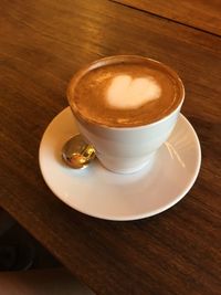 High angle view of coffee cup on table