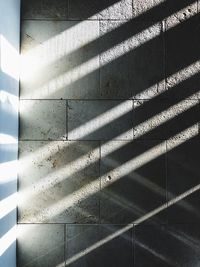 Full frame shot of shadow on tiled floor