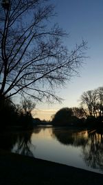 Scenic view of lake against sky at sunset