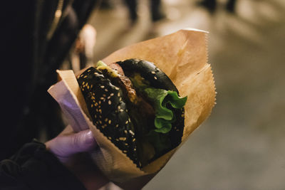 Close-up of hand holding leaf