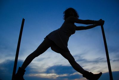 Low angle view of silhouette man against sky during sunset