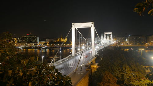 Illuminated elisabeth bridge over river danube against clear sky at night