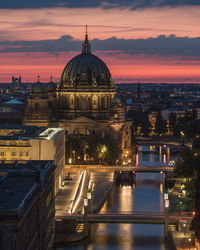 Illuminated buildings in city at night