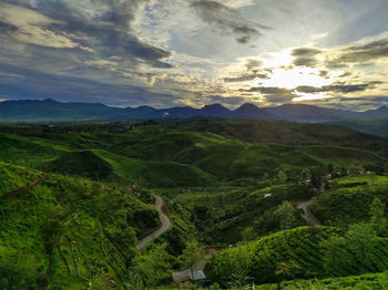 Scenic view of landscape against sky during sunset