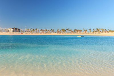 Scenic view of sea against clear blue sky