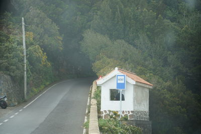 Road amidst trees in forest