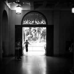 Woman walking in tunnel