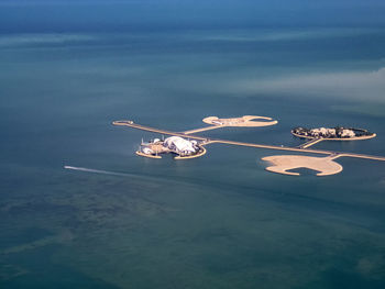 High angle view of illuminated ship in sea against sky