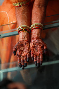 Low section of man holding hands