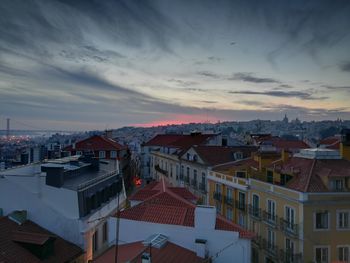 High angle view of houses against cloudy sky