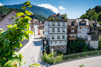 Buildings in town against sky