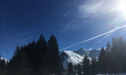 Low angle view of snowcapped mountain against sky